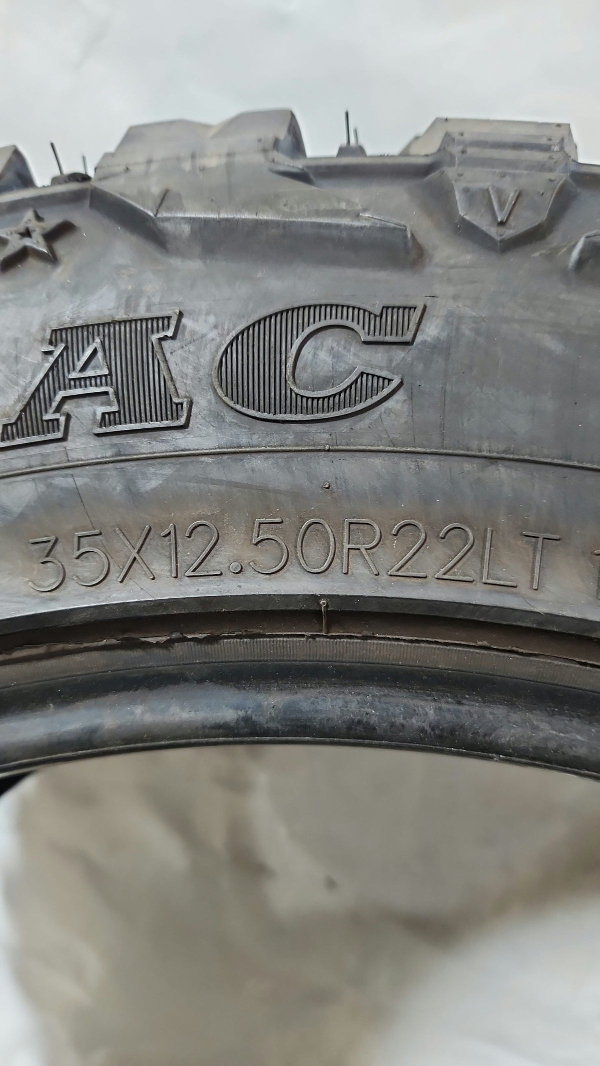 Used Tire - 35X12.50R22 Suretrac Wide Climber M/T 11/32